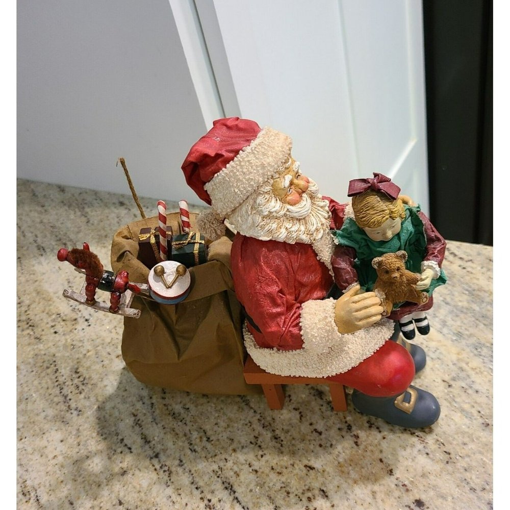 Clothique Sitting on Santas Lap. Girl Bear Bag of Toys Rocking Horse. Christmas